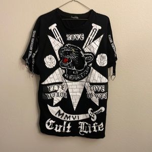 Black shirt with sequin panther, words and designs, and chains on sleeves